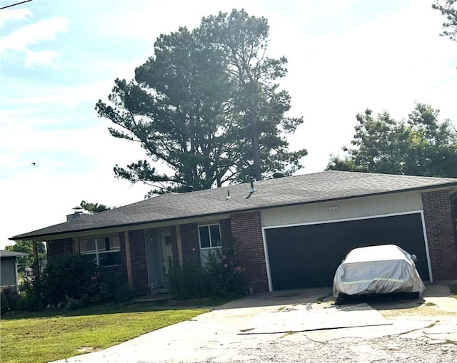 2305 S 16th St, Rogers, AR 72758 - single story home with brick siding, a garage, driveway, and a front lawn