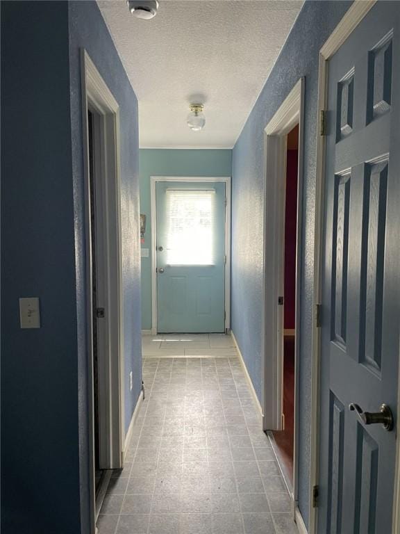 80 County Road 2560, Eureka Springs, AR 72631 - doorway with baseboards and a textured ceiling