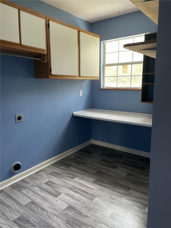 80 County Road 2560, Eureka Springs, AR 72631 - laundry room featuring cabinet space, hookup for an electric dryer, and wood finished floors