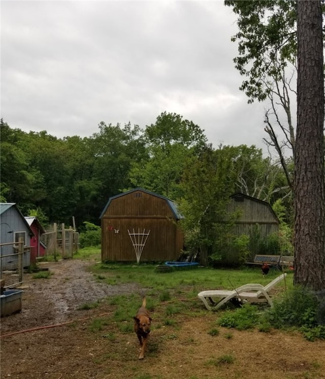 80 County Road 2560, Eureka Springs, AR 72631 - view of yard with a storage shed and a barn