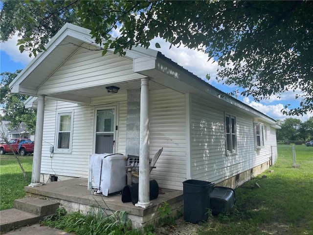 103 W 8th St, Green Forest, AR 72638 - view of side of home featuring a lawn