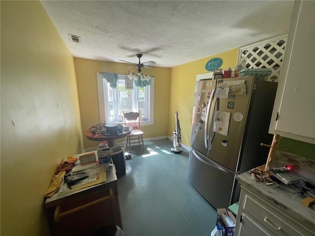 103 W 8th St, Green Forest, AR 72638 - dining room with a textured ceiling, ceiling fan, and dark wood finished floors