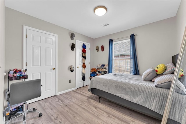 2317 SW Morris St, Bentonville, AR 72712 - bedroom with wood finished floors and baseboards