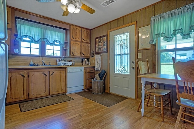 10746 Sr 27, Hector, AR 72843 - kitchen featuring white dishwasher, ceiling fan, brown cabinetry, light countertops, and light wood-type flooring