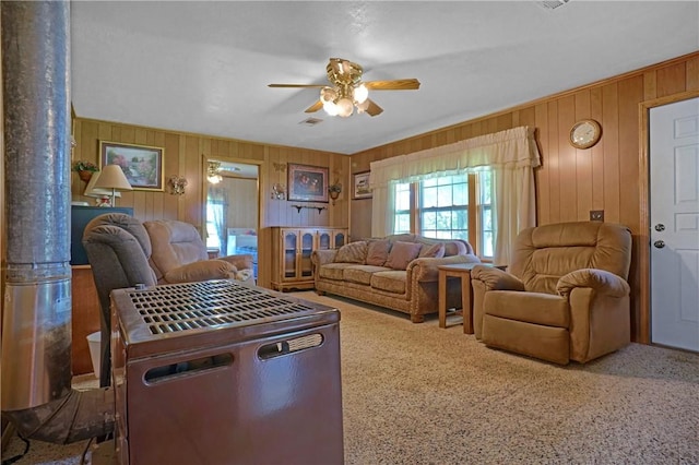 10746 Sr 27, Hector, AR 72843 - living room with wood walls, ceiling fan, and carpet
