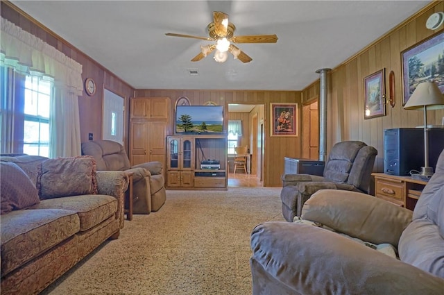10746 Sr 27, Hector, AR 72843 - living room with ceiling fan, wooden walls, ornamental molding, and carpet