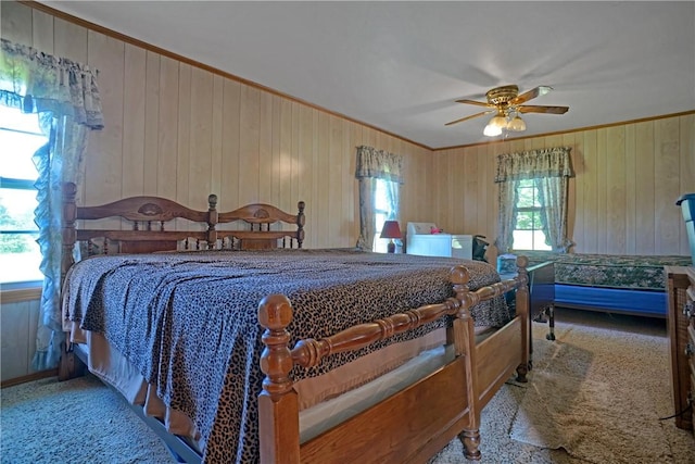 10746 Sr 27, Hector, AR 72843 - bedroom with crown molding, wooden walls, carpet floors, and ceiling fan