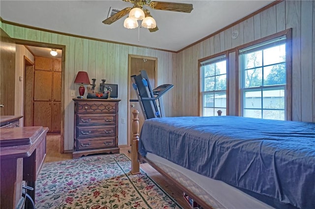 10746 Sr 27, Hector, AR 72843 - bedroom featuring crown molding, ceiling fan, and wood walls