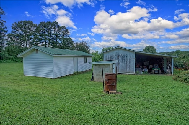 10746 Sr 27, Hector, AR 72843 - view of pole building with a yard and a carport