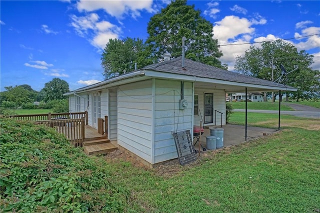 10746 Sr 27, Hector, AR 72843 - view of side of property with a lawn and a wooden deck