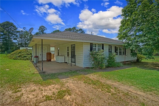 10746 Sr 27, Hector, AR 72843 - back of property with a lawn, a patio area, and a carport