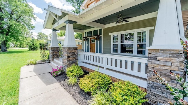 214 Lake Francis Dr, Siloam Springs, AR 72761 - covered porch with a lawn and ceiling fan