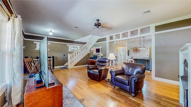 214 Lake Francis Dr, Siloam Springs, AR 72761 - living area featuring wood finished floors, stairs, and a ceiling fan