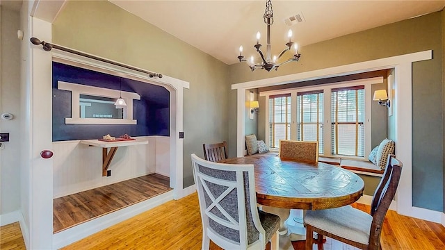 214 Lake Francis Dr, Siloam Springs, AR 72761 - dining room with a chandelier and wood finished floors