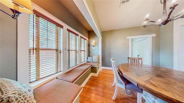 214 Lake Francis Dr, Siloam Springs, AR 72761 - dining area with hardwood / wood-style floors and a chandelier
