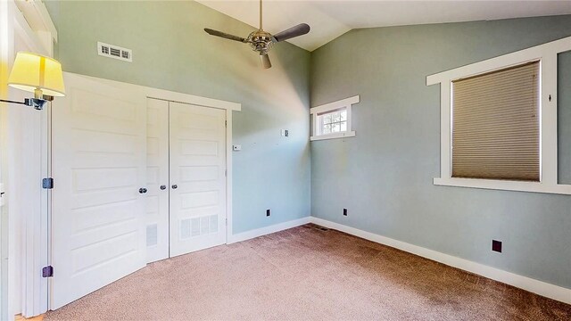 214 Lake Francis Dr, Siloam Springs, AR 72761 - unfurnished bedroom with carpet floors, a closet, ceiling fan, and high vaulted ceiling