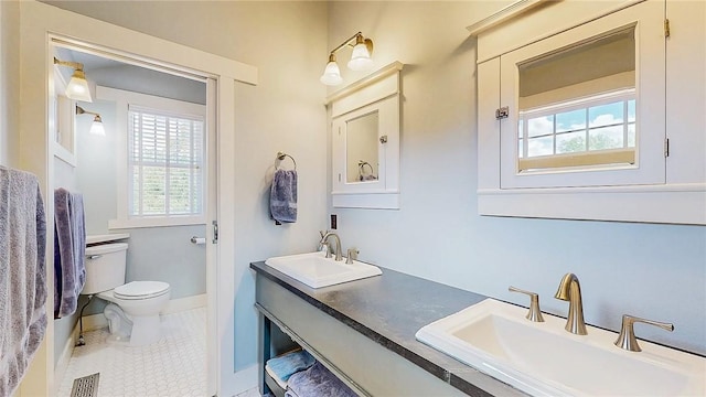 214 Lake Francis Dr, Siloam Springs, AR 72761 - bathroom with healthy amount of natural light, double vanity, and tile patterned floors