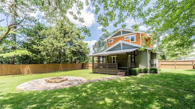 214 Lake Francis Dr, Siloam Springs, AR 72761 - back of property with an outdoor fire pit and a fenced backyard