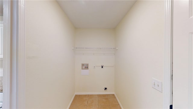 1142 S Jasmine Ln, Fayetteville, AR 72704 - laundry area featuring hookup for an electric dryer, hookup for a washing machine, and light tile patterned floors