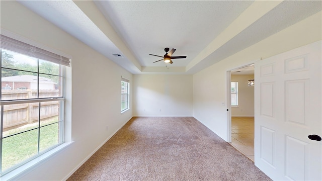 1142 S Jasmine Ln, Fayetteville, AR 72704 - unfurnished room featuring light carpet, ceiling fan, and a tray ceiling