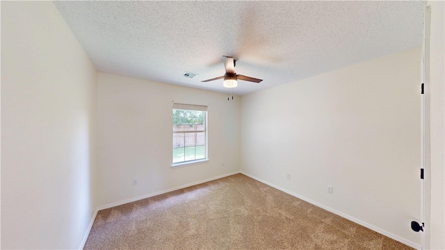 1142 S Jasmine Ln, Fayetteville, AR 72704 - unfurnished room featuring ceiling fan, light carpet, and a textured ceiling