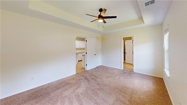 1142 S Jasmine Ln, Fayetteville, AR 72704 - unfurnished bedroom with light carpet, a raised ceiling, and ceiling fan