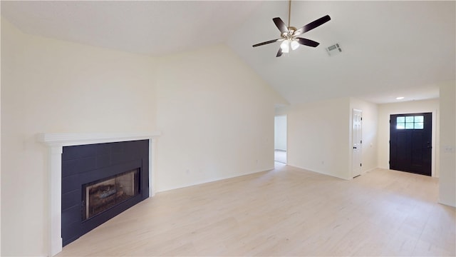 1142 S Jasmine Ln, Fayetteville, AR 72704 - unfurnished living room featuring light wood-type flooring, a fireplace, lofted ceiling, and a ceiling fan