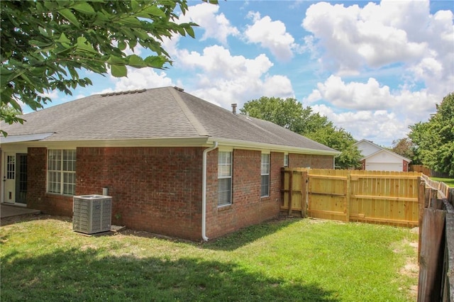 1142 S Jasmine Ln, Fayetteville, AR 72704 - view of home's exterior featuring brick siding and roof with shingles
