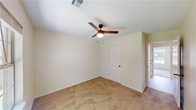 1142 S Jasmine Ln, Fayetteville, AR 72704 - unfurnished bedroom featuring carpet floors and ceiling fan