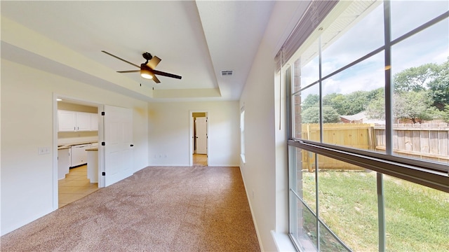 1142 S Jasmine Ln, Fayetteville, AR 72704 - empty room with light colored carpet, ceiling fan, and a tray ceiling