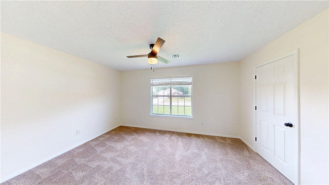 1142 S Jasmine Ln, Fayetteville, AR 72704 - unfurnished bedroom featuring carpet, a textured ceiling, and a ceiling fan