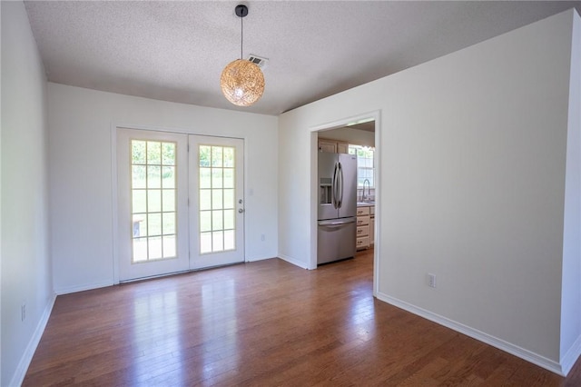 2472 W Jane Circle Dr, Fayetteville, AR 72704 - spare room featuring dark wood finished floors and a textured ceiling