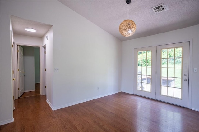 2472 W Jane Circle Dr, Fayetteville, AR 72704 - empty room featuring wood finished floors, a textured ceiling, and lofted ceiling