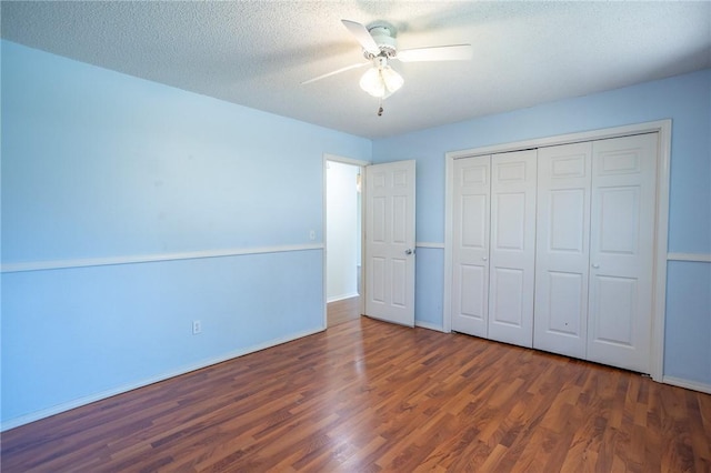 2472 W Jane Circle Dr, Fayetteville, AR 72704 - unfurnished bedroom with wood finished floors, a closet, ceiling fan, and a textured ceiling