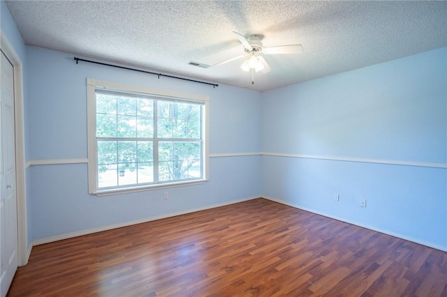2472 W Jane Circle Dr, Fayetteville, AR 72704 - unfurnished room with a textured ceiling, wood finished floors, and ceiling fan