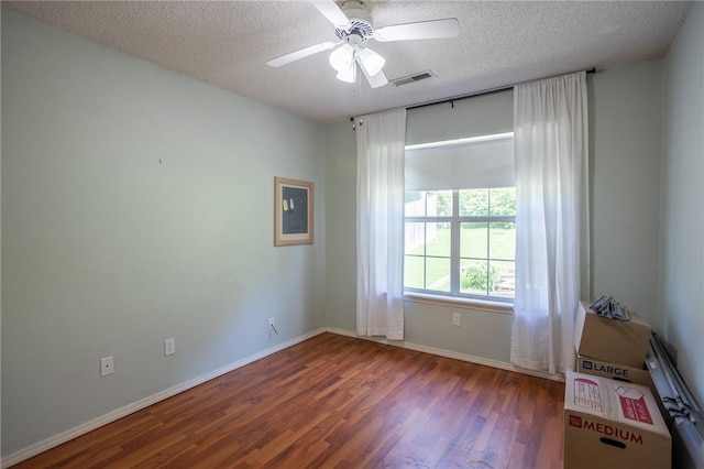 2472 W Jane Circle Dr, Fayetteville, AR 72704 - unfurnished room featuring wood finished floors, a ceiling fan, and a textured ceiling