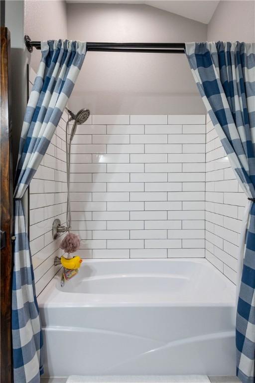 19475 Cotton Ln, Garfield, AR 72732 - bathroom featuring shower / bath combo with shower curtain