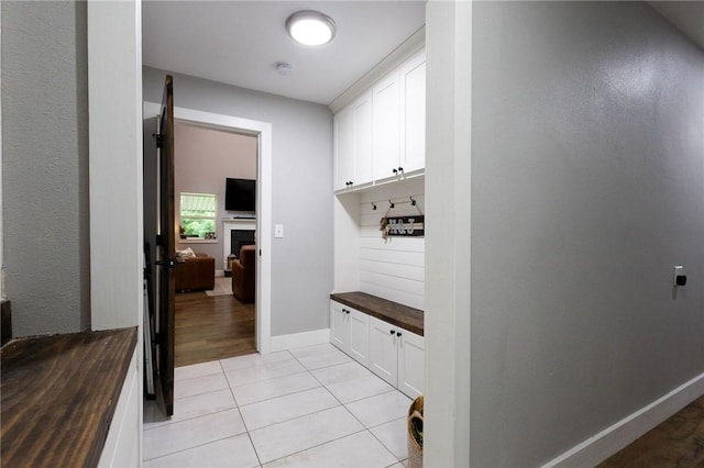 19475 Cotton Ln, Garfield, AR 72732 - mudroom with light tile patterned floors and baseboards