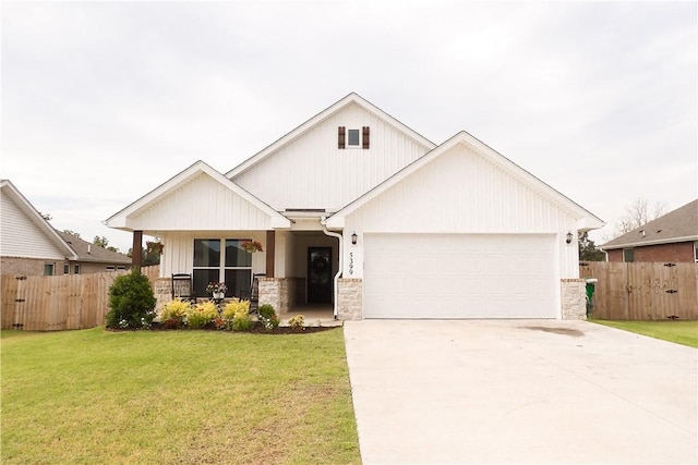 5399 Clear Springs Ave, Springdale, AR 72762 - view of front facade featuring stone siding, a garage, and driveway