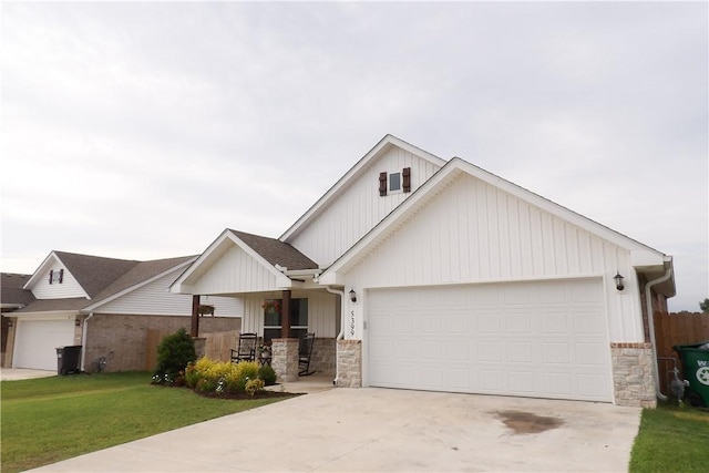 5399 Clear Springs Ave, Springdale, AR 72762 - view of front of property featuring a garage, concrete driveway, board and batten siding, stone siding, and a front lawn