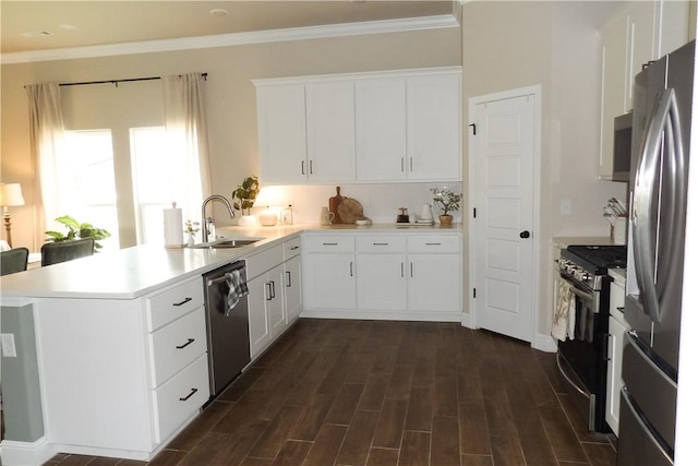 5399 Clear Springs Ave, Springdale, AR 72762 - kitchen with appliances with stainless steel finishes, a peninsula, white cabinets, light countertops, and dark wood-type flooring