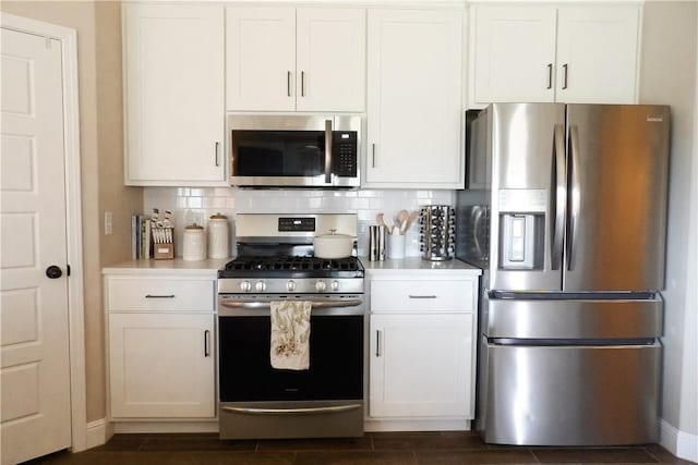 5399 Clear Springs Ave, Springdale, AR 72762 - kitchen with stainless steel appliances, light countertops, tasteful backsplash, and white cabinets