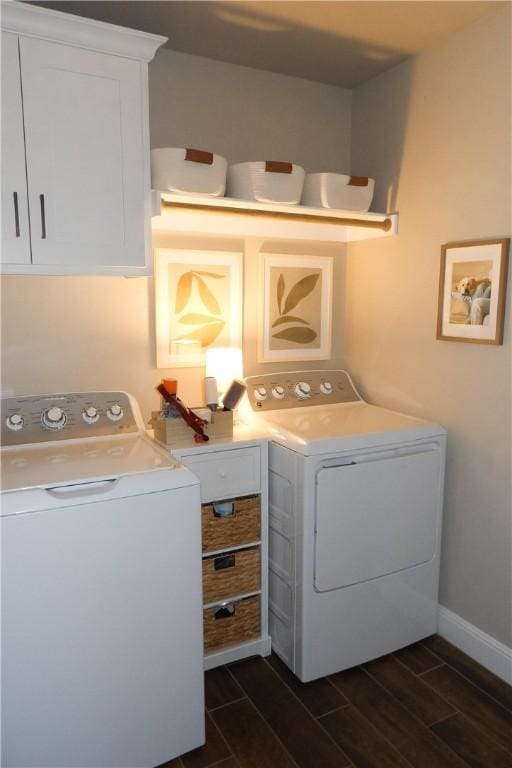 5399 Clear Springs Ave, Springdale, AR 72762 - laundry area featuring washing machine and clothes dryer, wood tiled floors, and cabinet space