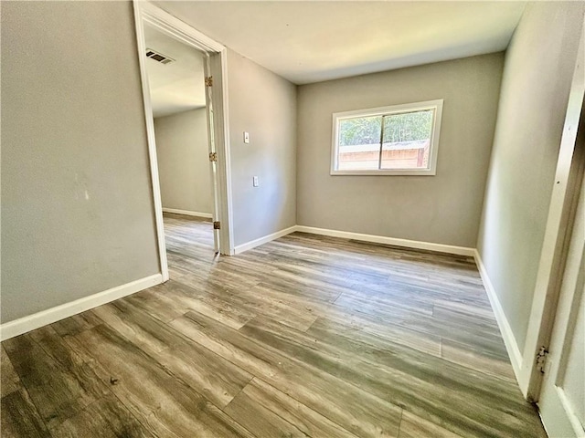 705 Commerce St, Morrilton, AR 72110 - spare room with wood finished floors and baseboards