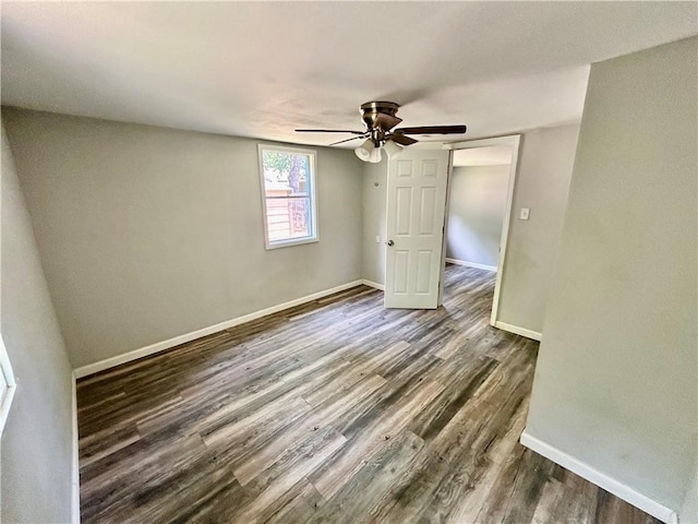 705 Commerce St, Morrilton, AR 72110 - empty room featuring ceiling fan and wood finished floors