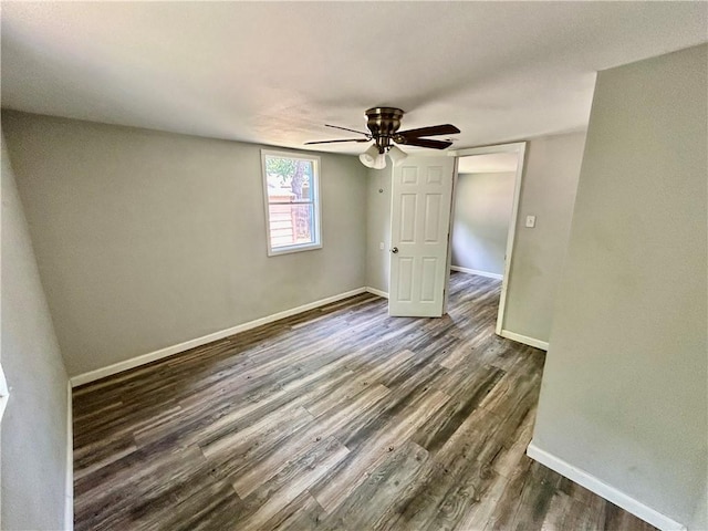 705 Commerce St, Morrilton, AR 72110 - empty room with dark wood-style floors and ceiling fan