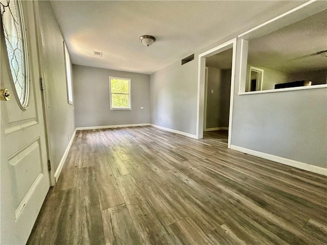 705 Commerce St, Morrilton, AR 72110 - spare room with wood finished floors and baseboards