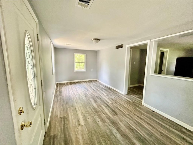 705 Commerce St, Morrilton, AR 72110 - unfurnished room with baseboards and wood finished floors