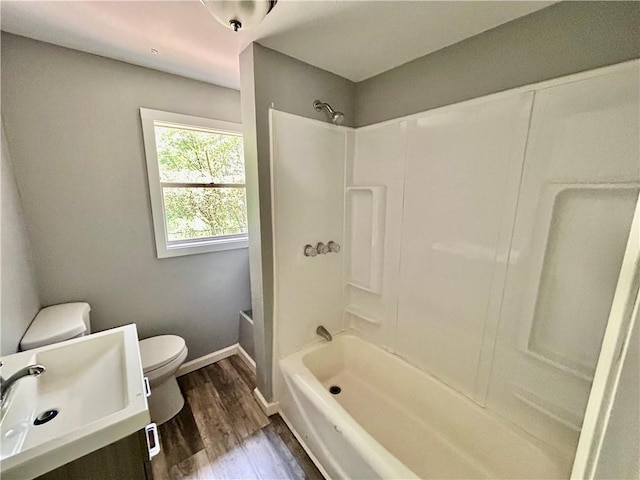 705 Commerce St, Morrilton, AR 72110 - full bathroom with bathing tub / shower combination, wood finished floors, and vanity