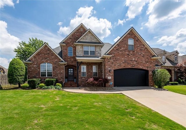 5503 S Turnberry Rd, Rogers, AR 72758 - view of front of home with driveway, a garage, and brick siding